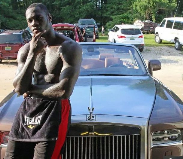 Jessica Scales-Wilder's ex-husband Deontay posing for photo with his car