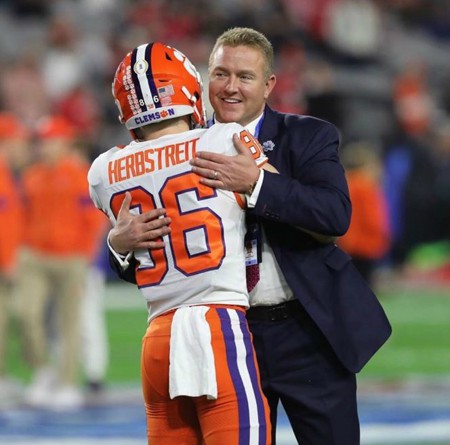 Kirk Herbstreit hugging his player