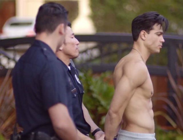 Ray Diaz arrested by police officer