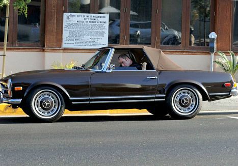 John Travolta driving his classical car