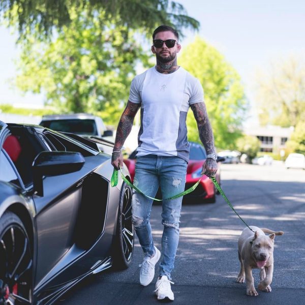 Danny Pimsanguan's husband Cody with his dog while car beside him