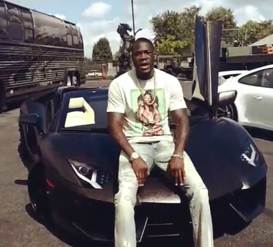 Jessica Scales-Wilder's ex-husband posing for a photo with his car