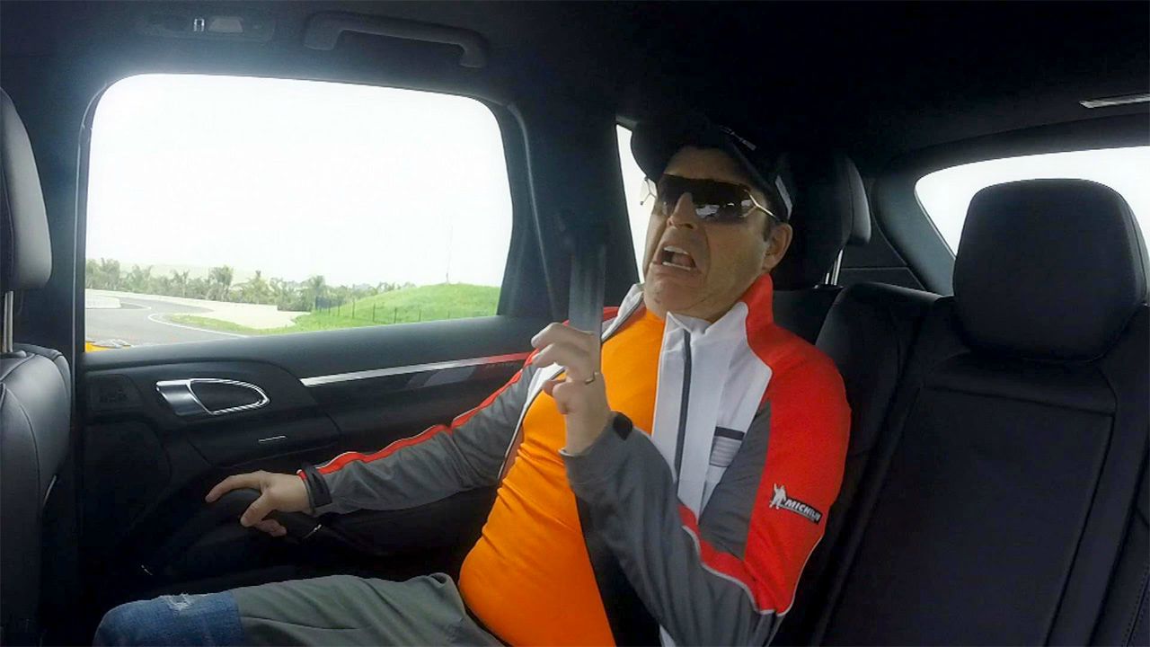 Andy Lassner sitting inside the car