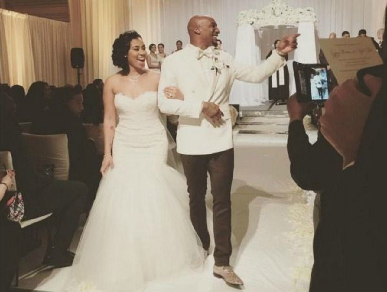 Gypsy Benitez with her husband Aqib Talib in their wedding dress