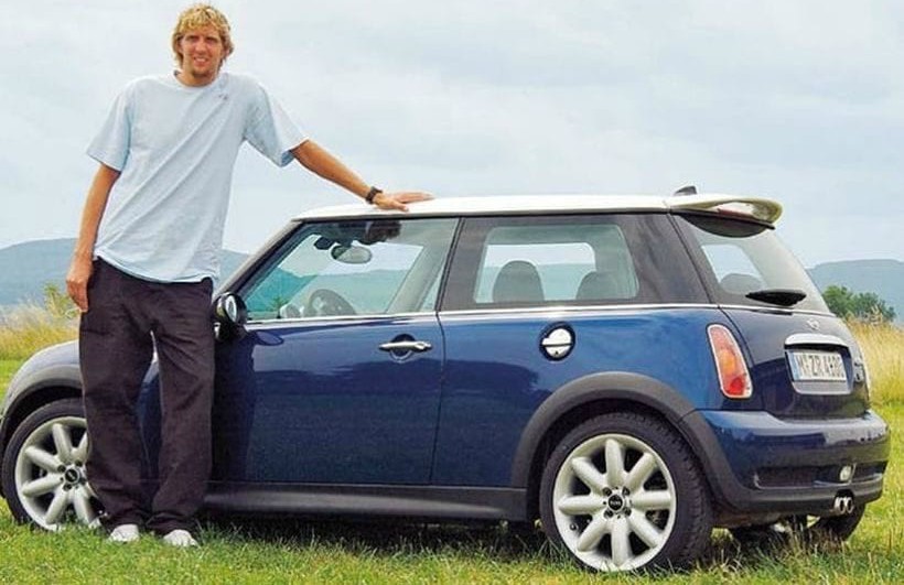 Malaika Nowitzki's father Dirk posing for a photo with car