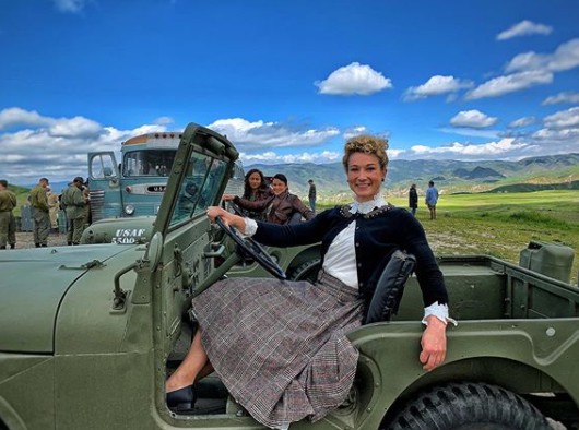 Jessie Graff posing for a picture sitting in the Jeep