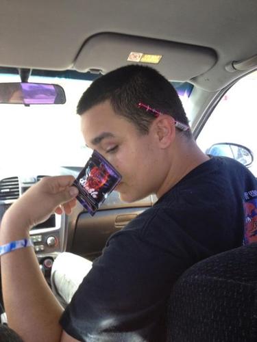 Jason Weaver posing for photo sitting inside the car