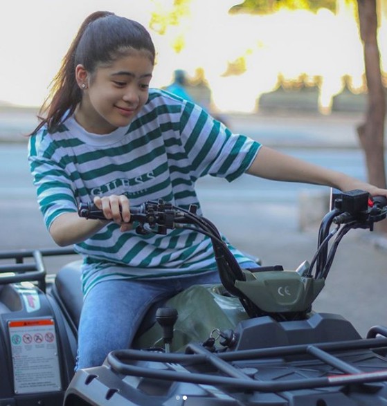 Niana Guerrero riding the sand bike