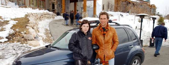 Clea DuVall and Matthew McConaughey pose with the PT Cruiser at the Chrysler Lodge during the Chrysler Million Dollar Film Festival