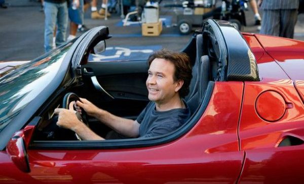 Timothy Hutton driving a classic car