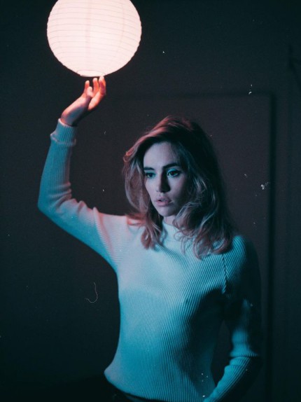 Suki Waterhouse posing for a photo