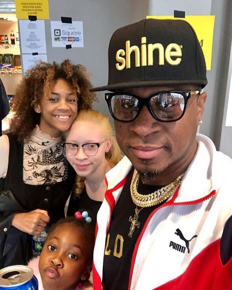 Darrell Delite Allamby clicking selfie with his kids
