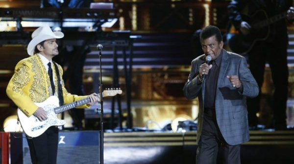 Charley Pride performing in the stage