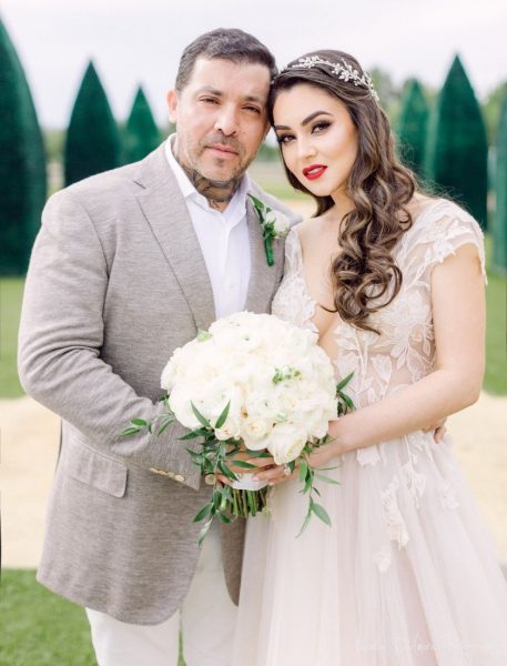 Angel del Villar with his wife in their wedding dress