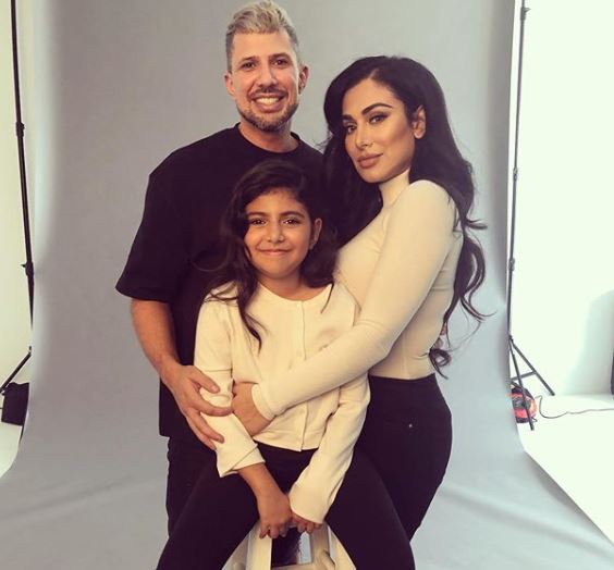 Huda with her husband and daughter