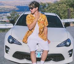 Caption: Jesse Giddings with his car