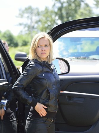 Caption : Emilie Ullerup posing the photo with car