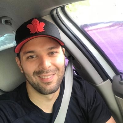 Caption: Alejandro Fernandez posing the photo inside car