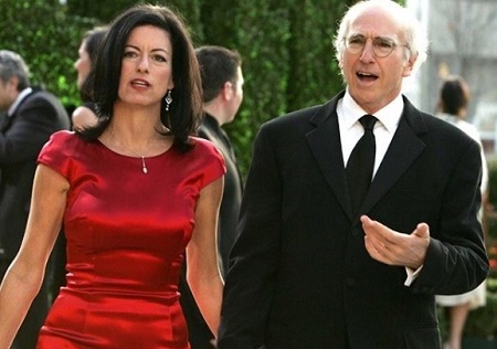 Caption: Romy's father and mother posing for the photo(