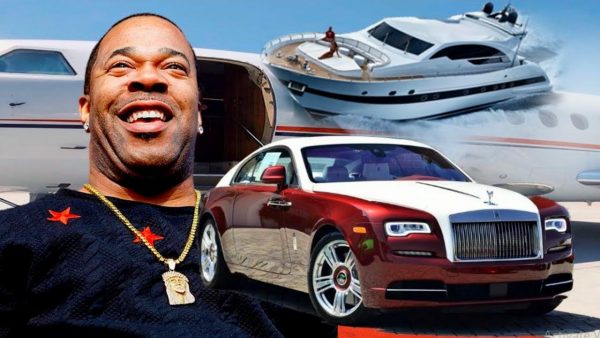 Caption :Busta Rhymes posing for the photo with car 
