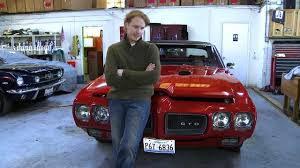 Caption :Grant Achatz with his car