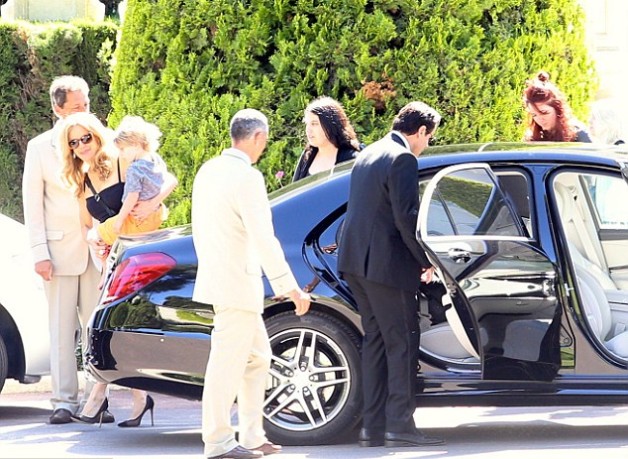 Caption :Ella and her family with her car
