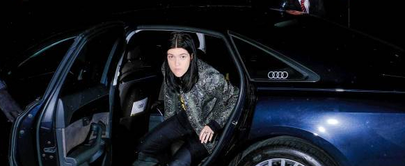 Caption: Romy David with her car