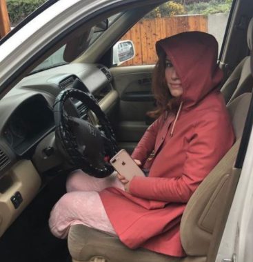Maria Thayer sitting inside the car 
