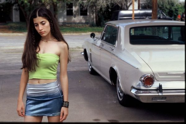 Caption: Tania Raymonde posing for the photo with car