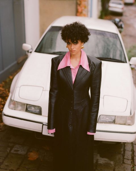 Caption: Jordan Loughran Posing for the photo with her car