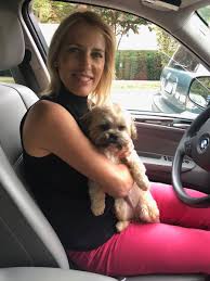 Caption : Maria Caroline Ingraham's mother Laura Ingraham inside the car with puppy