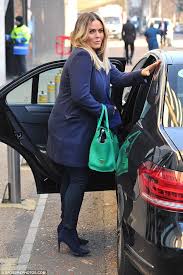 Caption : Patsy Kensit posing for the photo with her car