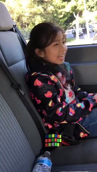 Caption: Celine Tam inside the car
