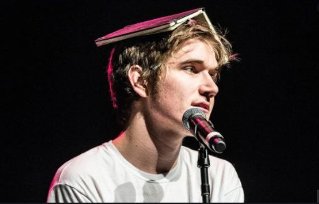 Bo Burnham singing song in the stage