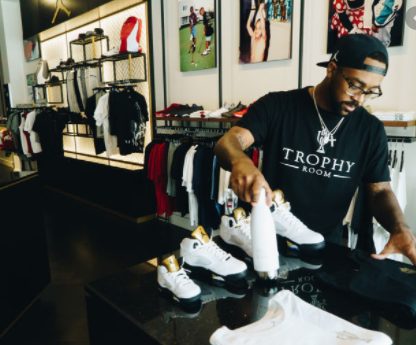 Marcus Jordan packing shoes to deliver as per people order