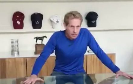 Skip Bayless sitting inside the house