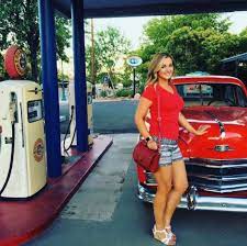 Katie Pavlich poses for a photo with her car