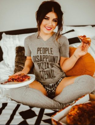 Leighla Schultz sitting in the bed