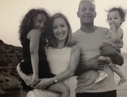 Vicky Gomershall posing for a photo with her husband and two beautiful daughters