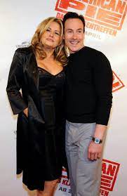 Caption: Jennifer Coolidge with her husband