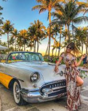 Paloma Jimenez posing for a photo with her car