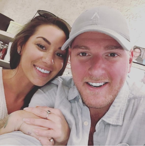 Pat McAfee posing for the photo with his wife Samantha Ludy