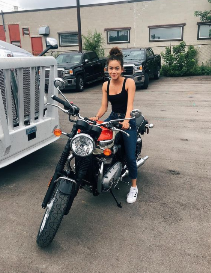 Antonia Gentry posing for a photo with bike