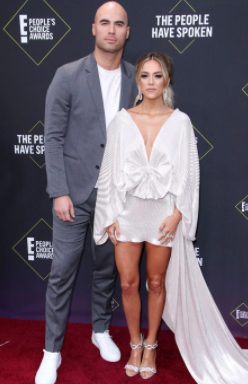 Mike Caussin posing for a photo with his lovely wife Jana Kramer