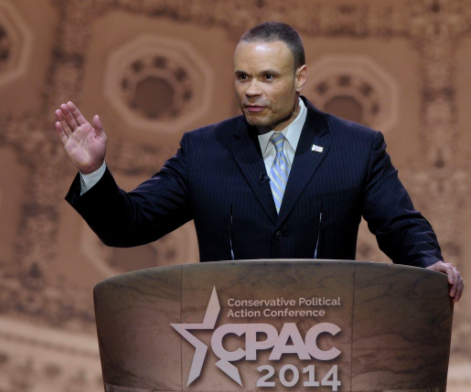 Dan Bongino giving speech in the stage