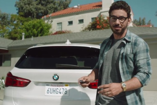 Al Madrigal posing with his car