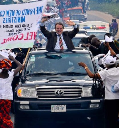 Anni Suelze's late-husband, Reinhard Bonnke posing with his car