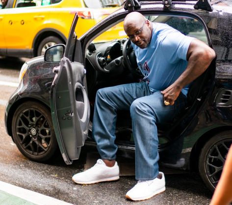 Arnetta Yardbourgh ex-boyfriend, Shaquille O'Neal posing with his car