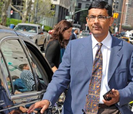 Dixie Brubaker's ex-husband, Dinesh D'souza posing with his car