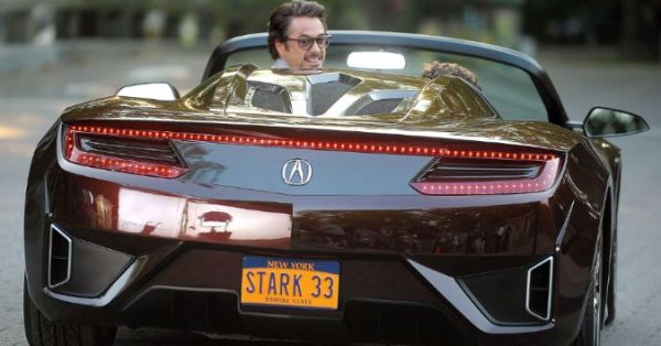 Jimmy Rich's boss, Robert Downey Jr posing on his car